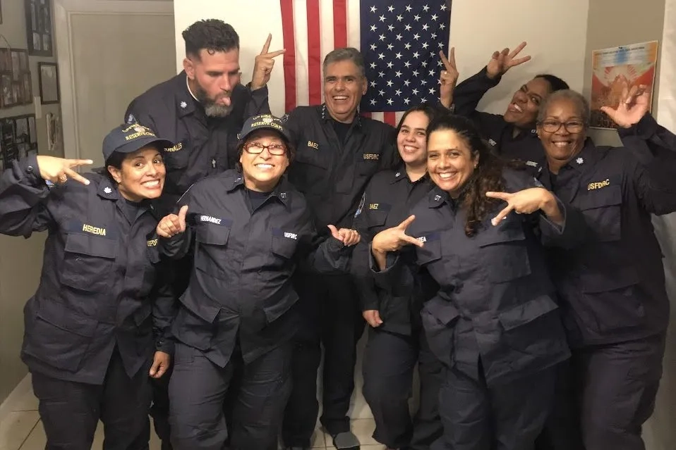 Group of people in US Coast Guard uniforms.