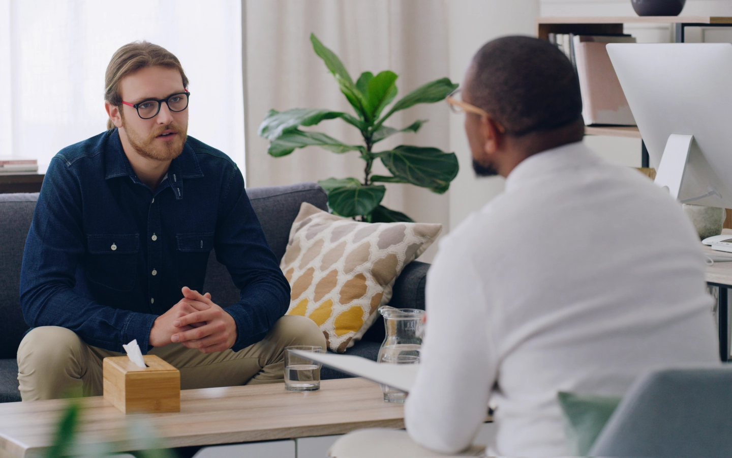 Man in therapy session with therapist.