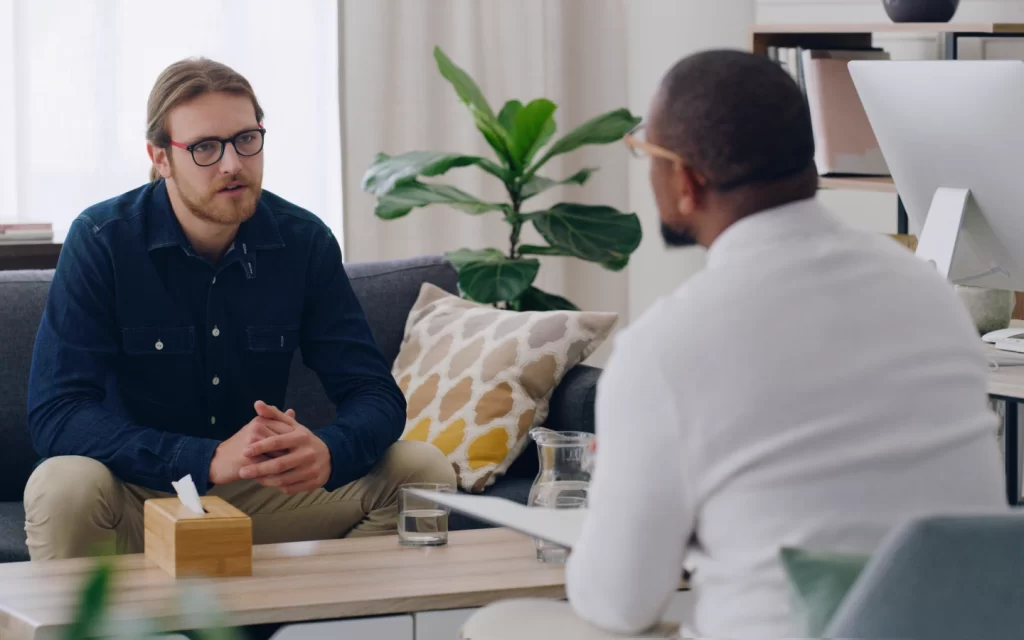 Two men talking in therapy session